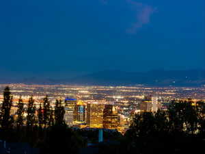 Twilight view of city with a mountain view