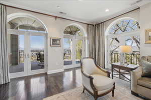 Sitting room with french doors, crown molding, and recessed lighting