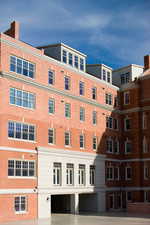 View of apartment building / complex featuring a garage
