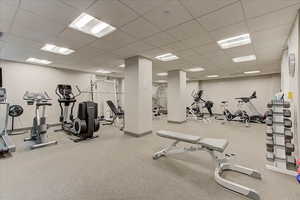 Workout area with a paneled ceiling