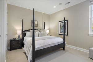 Bedroom featuring ornamental molding, light carpet, and recessed lighting