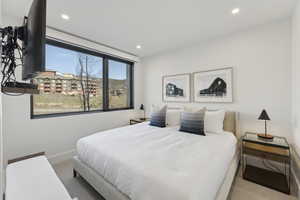 Bedroom featuring carpet and recessed lighting