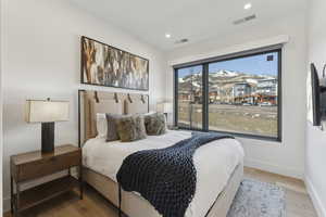 Bedroom featuring light wood-type flooring and recessed lighting