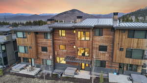 Property at dusk featuring a mountain view