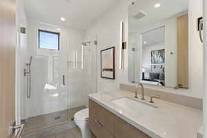 Full bath with ensuite bath, vanity, a stall shower, and recessed lighting