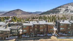 View of mountain backdrop with nearby suburban area