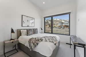 Carpeted bedroom featuring a mountain view and recessed lighting