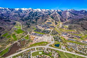 Aerial view of property's location with a mountainous background