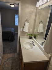 Ensuite bathroom with vanity and tile
