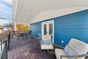 Covered back deck with dining space and gas line for a grill or fire pit