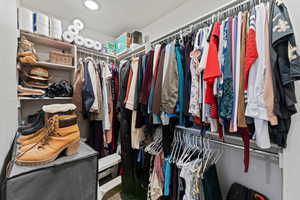 Primary bedroom walk-in closet