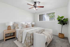 Bedroom featuring carpet and a ceiling fan