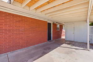 View of patio featuring a carport