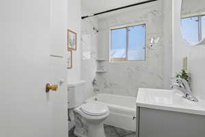 Bathroom with vanity and shower / bath combination