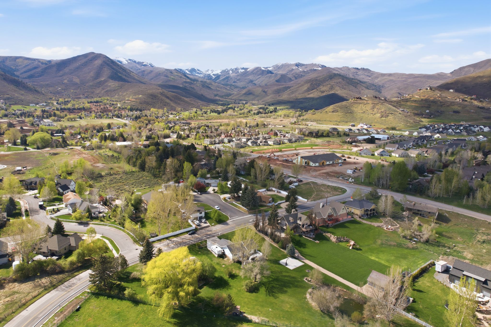 Aerial view of residential area featuring mountains