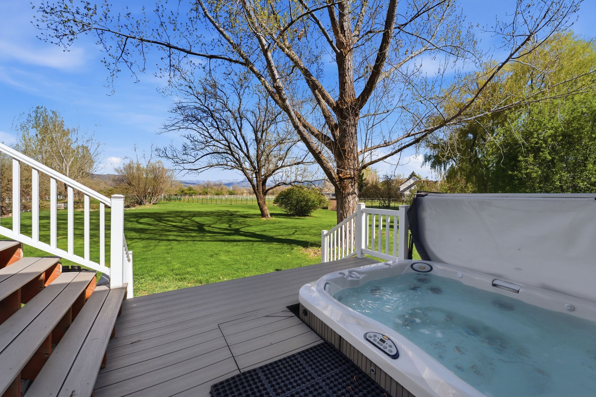 outdoor hot tub and a yard