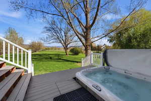 outdoor hot tub and a yard