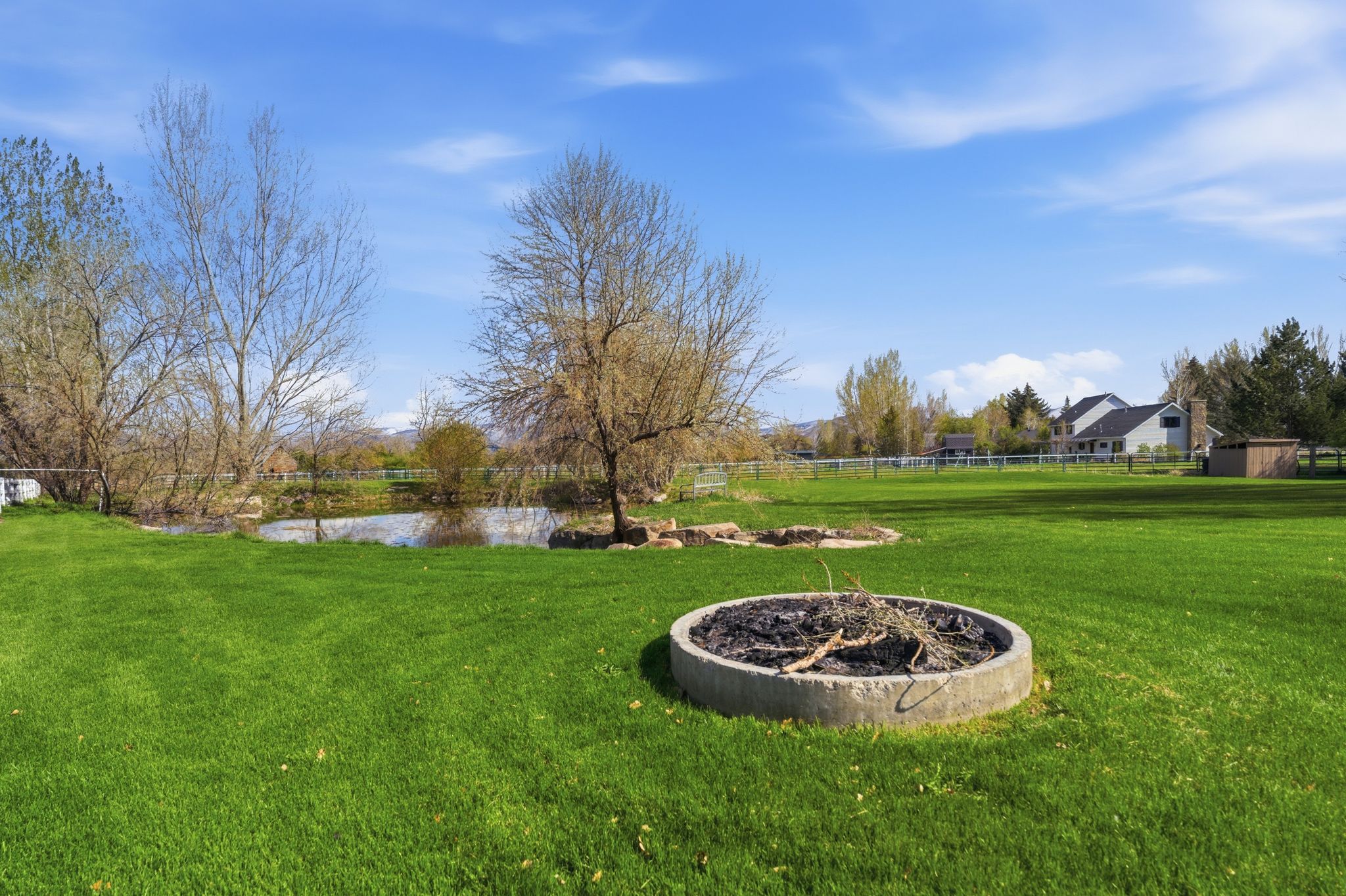 View of yard with an outdoor fire pit