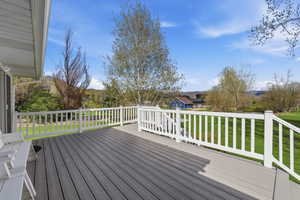 large deck off kitchen offers privacy and serenity