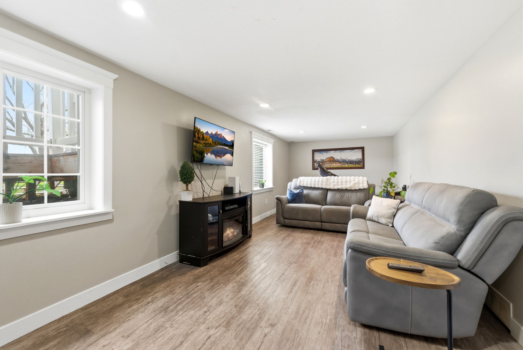 Living area featuring light wood-type flooring and recessed lighting