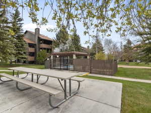 View of home's community featuring a swimming pool, a pergola, and a patio
