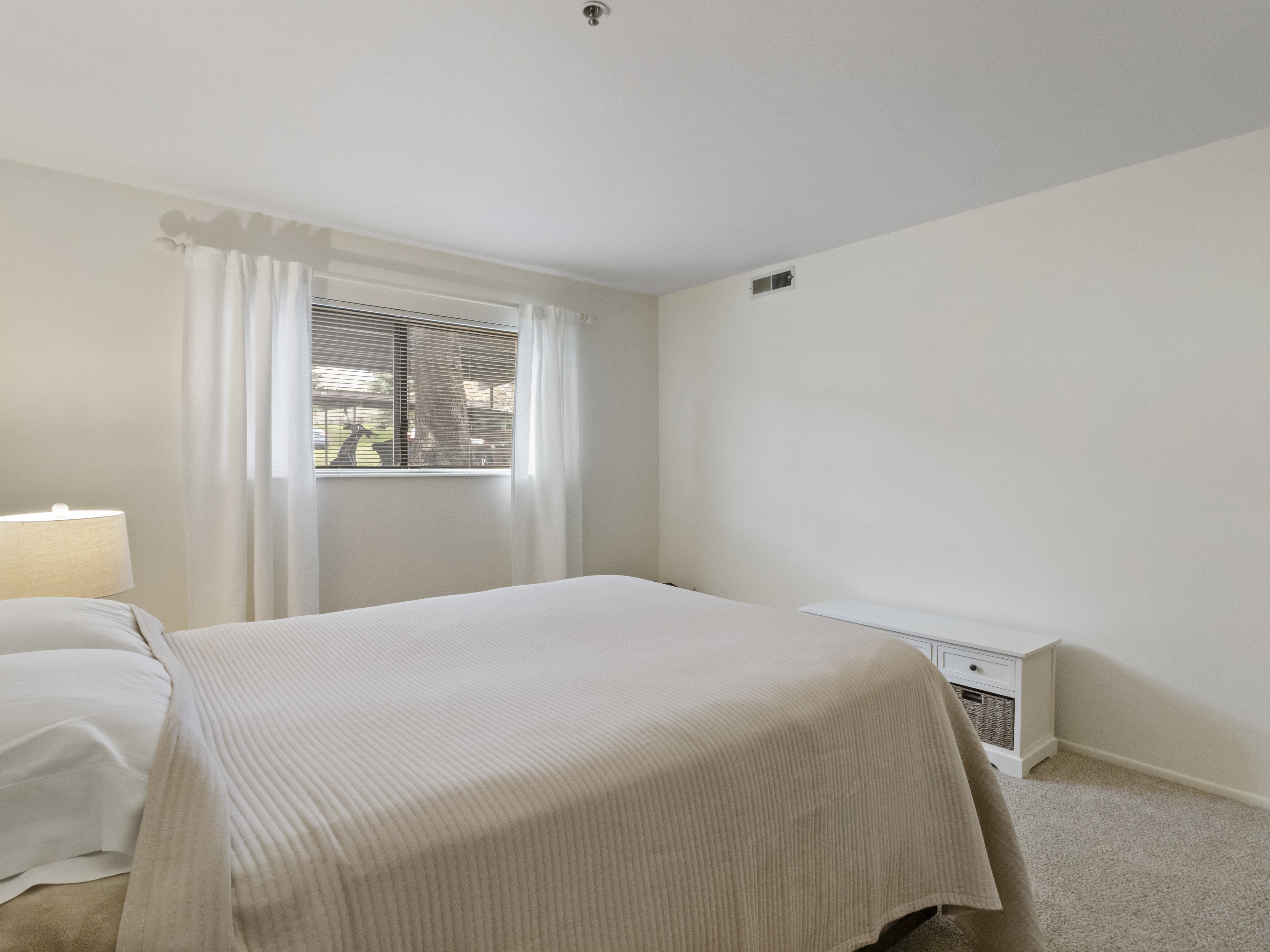 Bedroom featuring carpet flooring and baseboards