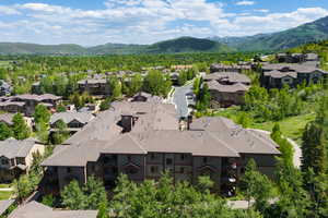 Aerial perspective of suburban area featuring a mountain backdrop