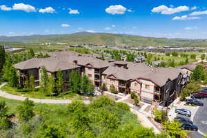 Aerial perspective of suburban area with a mountain backdrop