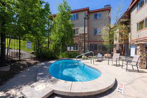 View of swimming pool featuring patio surround and a pool