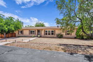Ranch-style house with stucco siding