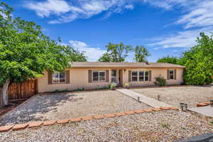 Ranch-style house with a shingled roof