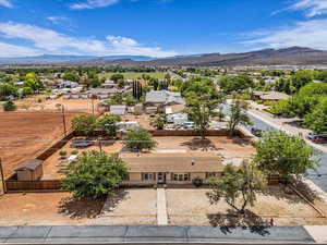 Aerial perspective of suburban area with a mountain backdrop