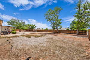 View of fenced backyard