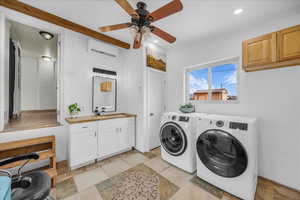 Laundry area featuring cabinet space, a ceiling fan, washing machine and clothes dryer, and recessed lighting