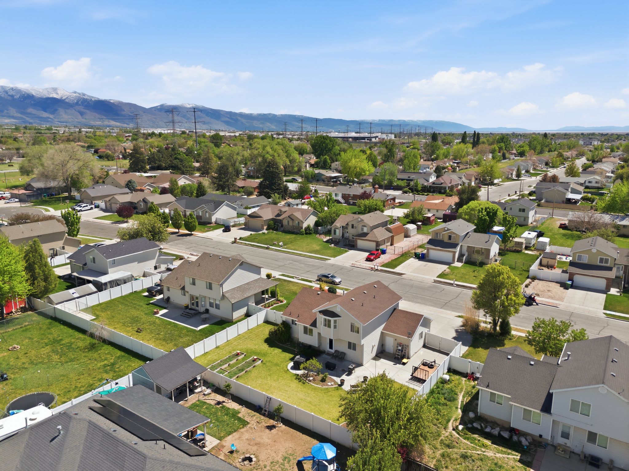 Aerial perspective of suburban area featuring a mountainous background