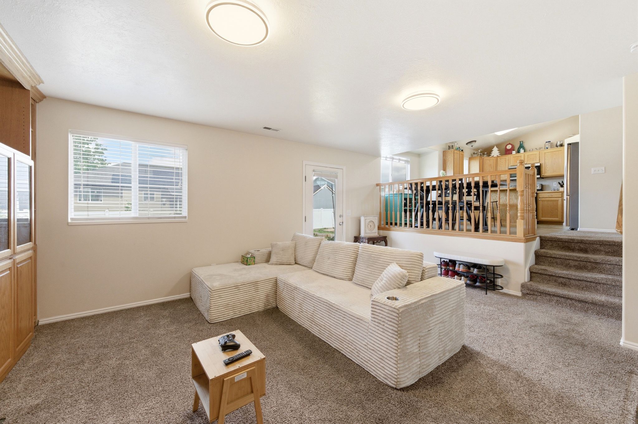 Living area with carpet floors and healthy amount of natural light