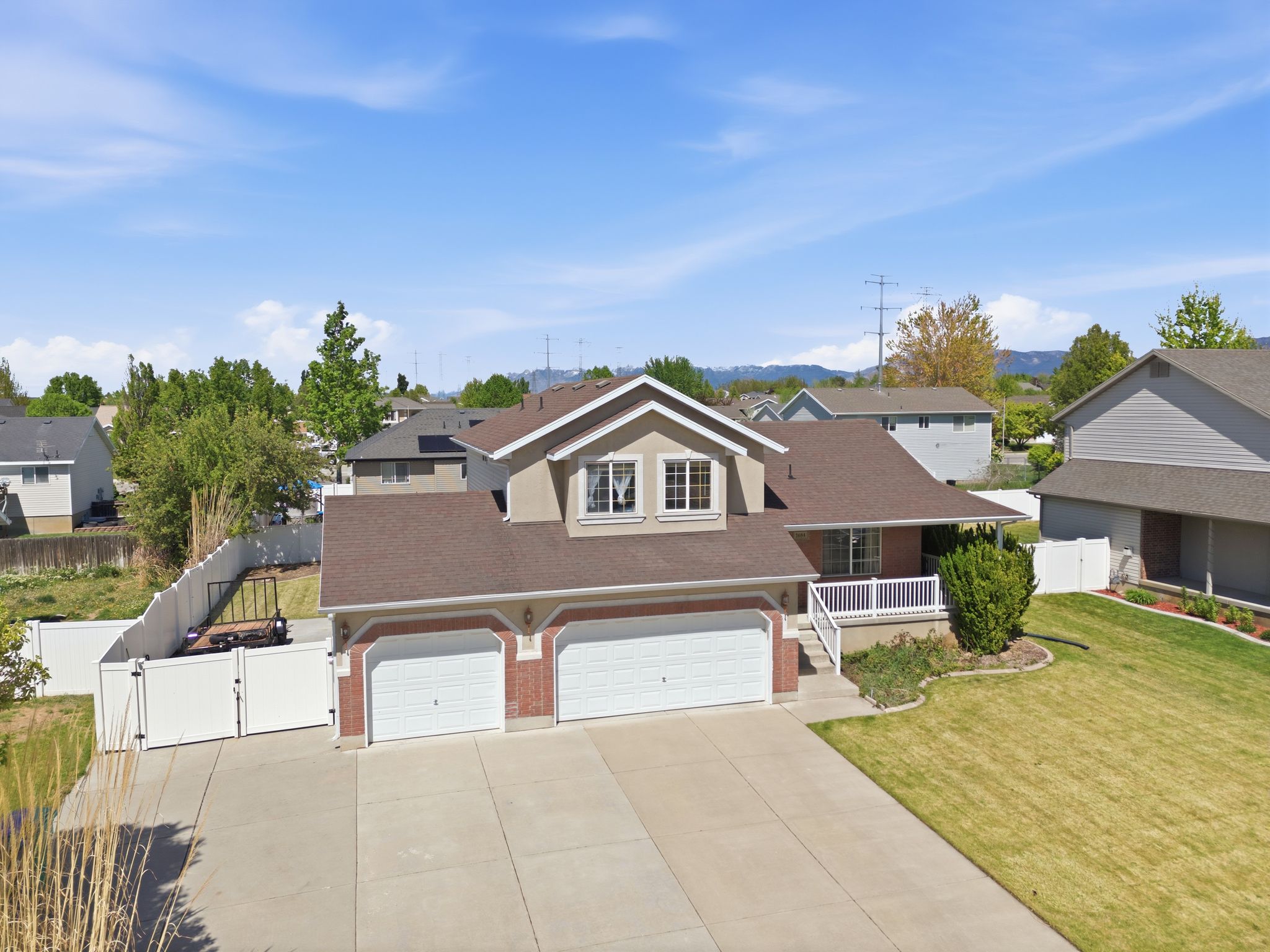 Three car garage and a large covered porch