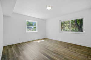 Unfurnished room featuring baseboards and light wood finished floors