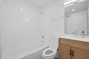 Bathroom with vanity and shower / tub combination