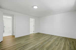 Empty room with light wood finished floors