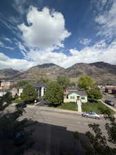 View of mountain background featuring nearby suburban area