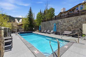 Community pool with a patio area