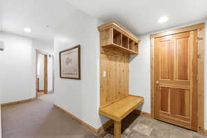 Mudroom featuring recessed lighting and light carpet