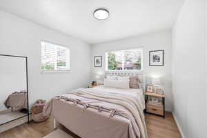 Bedroom featuring baseboards and light wood-style flooring