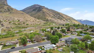 Aerial view of residential area with a mountainous background