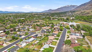 Aerial perspective of suburban area with a mountain backdrop
