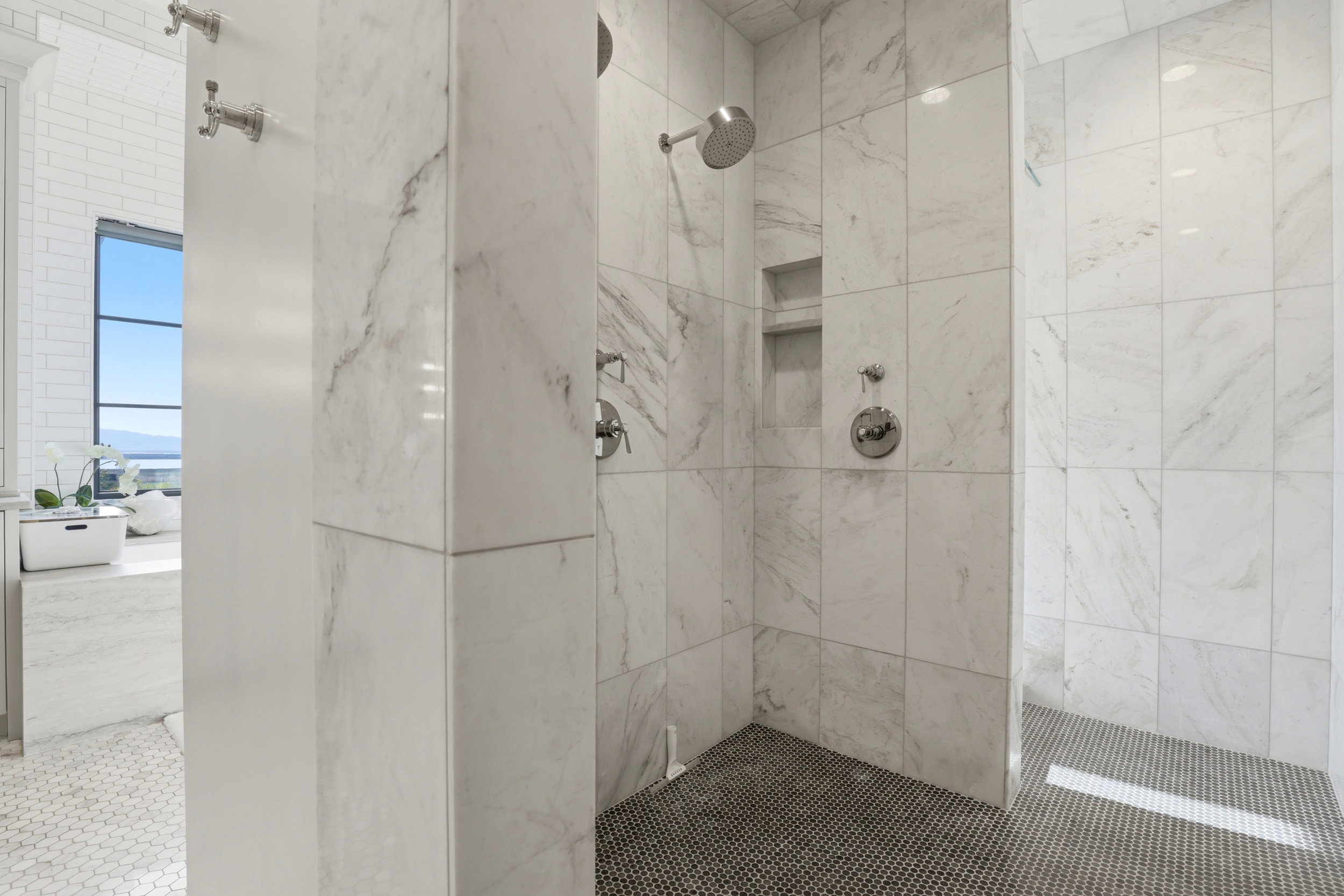 Bathroom with a marble finish shower