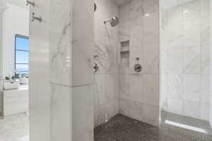 Bathroom with a marble finish shower