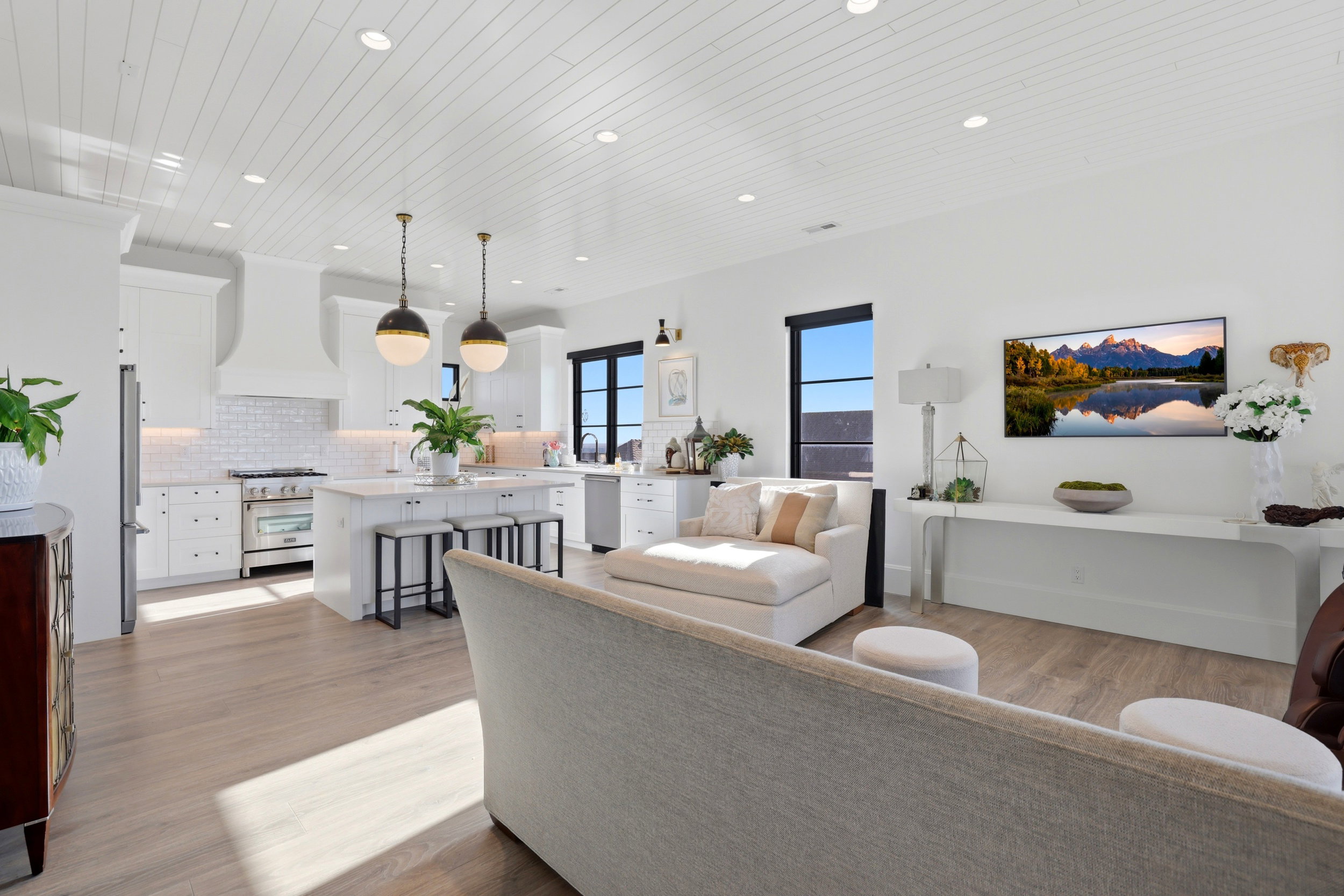 Living area featuring light wood-type flooring, wooden ceiling, and recessed lighting