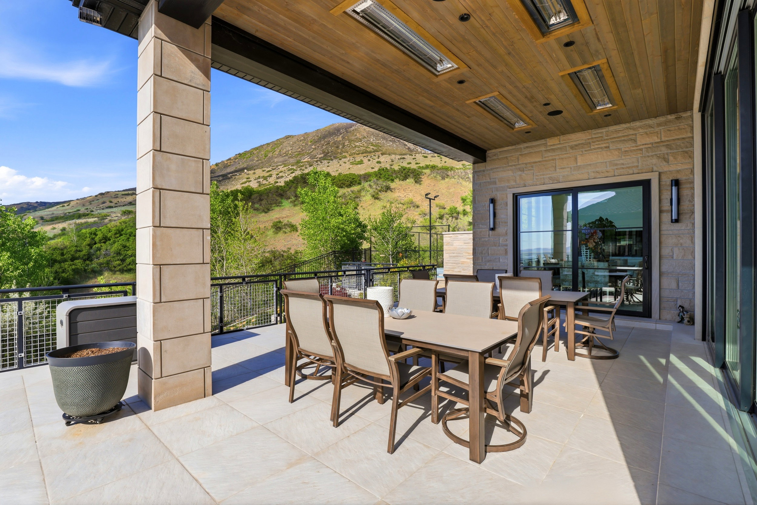View of patio with outdoor dining area and a mountain view